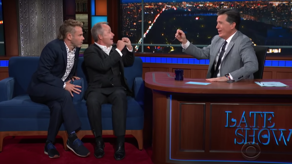 Dominic Monaghan and Billy Boyd huddle with glee on The Late Show with Stephen Colbert.