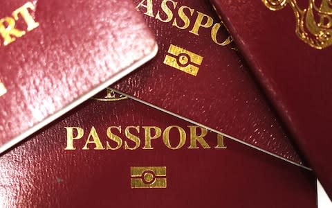 A collection of burgundy red British passports - Credit: &nbsp;Chris Ratcliffe/&nbsp;Bloomberg