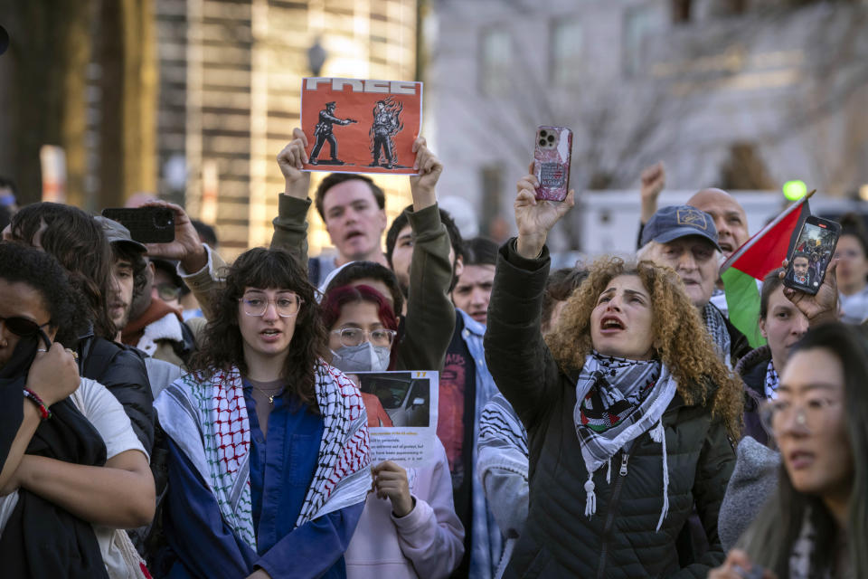 Demonstrators gather during a vigil outside the Israeli Embassy, Monday, Feb. 26, 2024, in Washington. An active-duty member of the U.S. Air Force died after he set himself ablaze outside the Israeli Embassy in Washington, while declaring that he "will no longer be complicit in genocide." (AP Photo/Mark Schiefelbein)