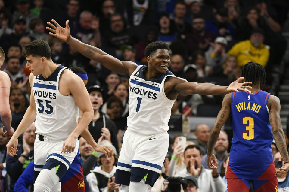 Minnesota Timberwolves guard Anthony Edwards (1) reacts after making a basket against the Denver Nuggets during the second half of an NBA basketball game Monday, Jan. 2, 2023, in Minneapolis. (AP Photo/Craig Lassig)