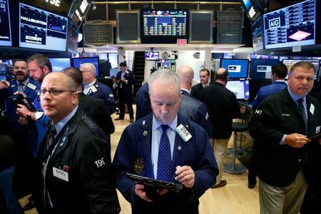 Traders work on the floor of the New York Stock Exchange (NYSE) in New York City, U.S., November 7, 2016. REUTERS/Brendan McDermid