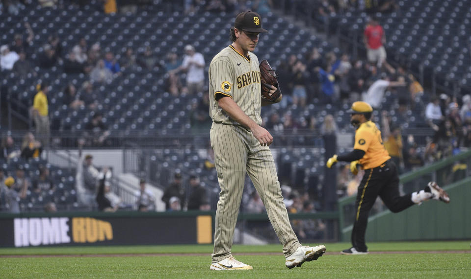 San Diego Padres starting pitcher Reiss Knehr waits as Pittsburgh Pirates' Carlos Santana runs the bases after hitting a solo home run during the third inning of a baseball game Tuesday, June 27, 2023, in Pittsburgh. (AP Photo/Justin Berl)