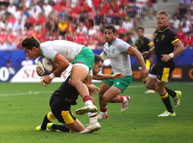 Portugal’ captain Tomas Appleton is tackled by Wales’ Tomos Williams 