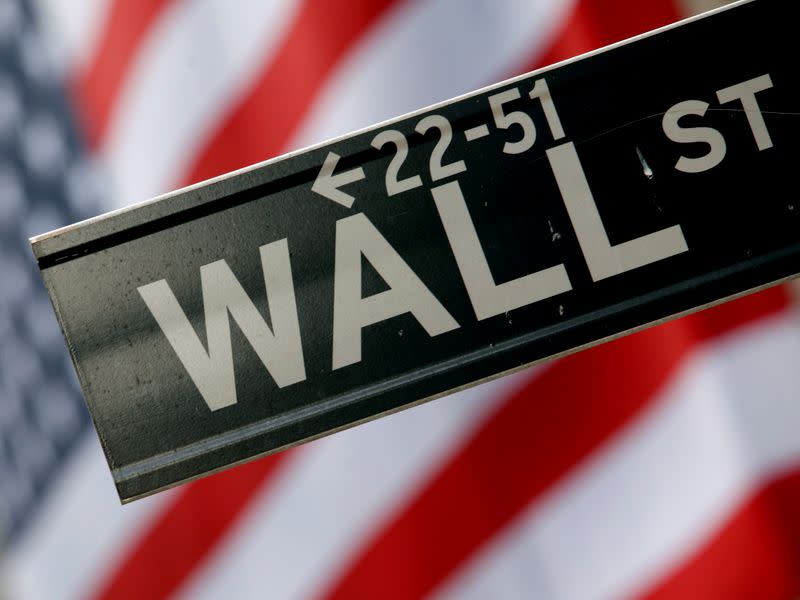 FILE PHOTO: A street sign is seen in front of the New York Stock Exchange on Wall Street in New York