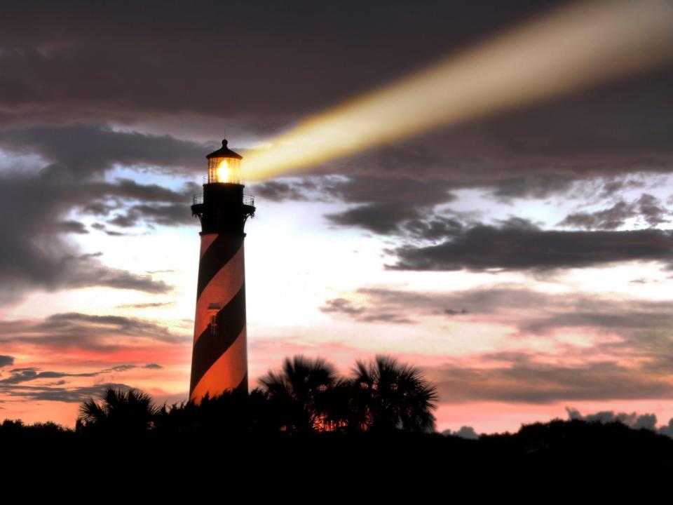 The beam from the St. Augustine Lighthouse at night.