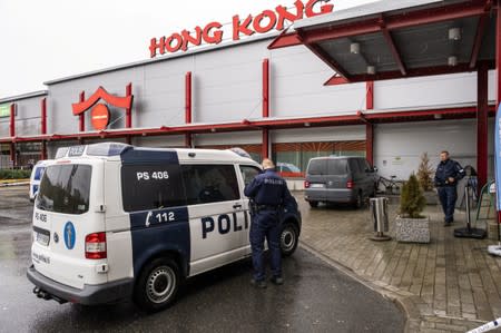 Policemen are seen in front of the Herman shopping center where the Savo Vocational College is located in Kuopio