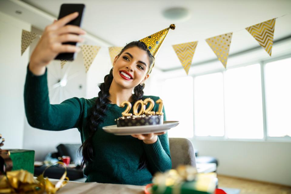 Woman having video call while she preparing for New Years