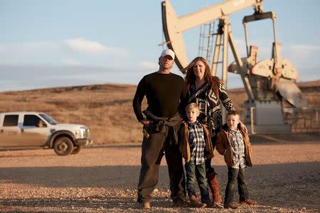 The Moorhead family -- (L-R) Ben Moorhead, Falcon Moorhead, Phoebe Moorhead and Titan Moorhead of Boomtowners is pictured in Sidney, Montana in this November 2014 handout photo. REUTERS/Smithsonian Channel/Handout via Reuters