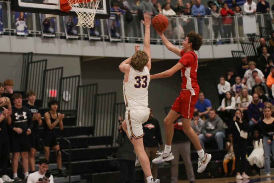 DCG's Jackson Green puts up a shot against Waukee's Cade Littlefield during a Class 4A high school boys basketball substate final on Tuesday, Feb. 28, 2023, at Waukee Northwest High School.