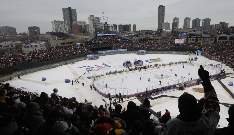 FILE - In this Jan. 1, 2009 file photo, fans cheer during the first period of the NHL Winter Classic hockey game between the Detroit Red Wings and the Chicago Blackhawks at Wrigley Field in Chicago. The NHL Winter Classic is going back to Wrigley Field. The league announced Wednesday night, Feb. 7, 2024 that the Chicago Blackhawks will host the St. Louis Blues at the iconic ballpark for the next edition of one of hockey's marquee events. (AP Photo/M. Spencer Green, File)