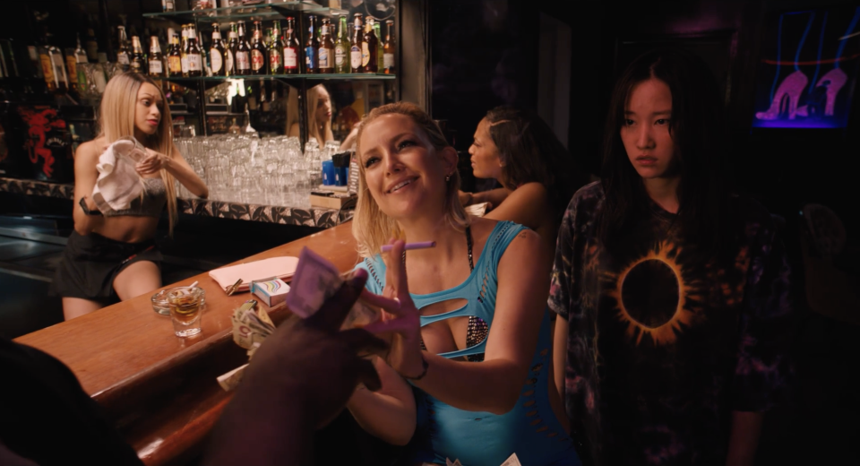 Kate Hudson (center) plays an exotic dancer who uses a mysterious asylum escapee (Jeon Jong-seo) with superpowers to make some extra money in "Mona Lisa and the Blood Moon."