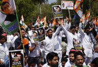 Supporters of opposition Congress party shout slogans as they protest against their leader Rahul Gandhi's expulsion from Parliament in New Delhi, India, Monday, March 27, 2023. Gandhi was expelled from Parliament a day after a court convicted him of defamation and sentenced him to two years in prison for mocking the surname Modi in an election speech. (AP Photo/Deepanshu Aggarwal)