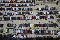 Palestinian worshipers pray during the first Friday of the holy month of Ramadan at the Al Aqsa Mosque compound in Jerusalem's old city, Friday, April. 16, 2021. (AP Photo/Mahmoud Illean)