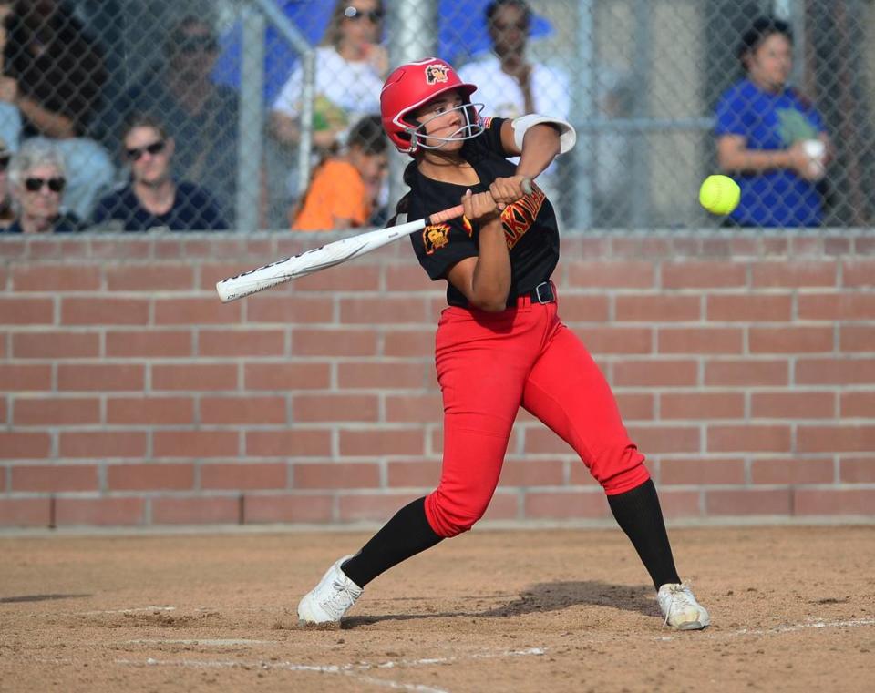 Oakdale’s Jaelyn Lee (4) swings at the ball during a game between Oakdale and Central Catholic at Oakdale High School in Oakdale, Calif. on April 17, 2024. Central Catholic won 6-2.