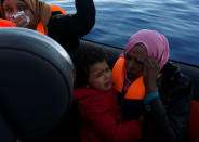 Migrants react after being rescued by the Malta-based NGO Migrant Offshore Aid Station (MOAS) from a wooden boat in the central Mediterranean in international waters off the coast of Sabratha in Libya, April 15, 2017. REUTERS/Darrin Zammit Lupi