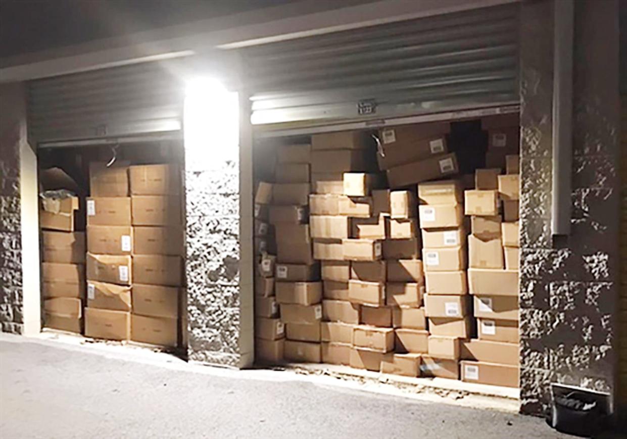 Stolen retail goods are pictured in a storage unit at an unspecified location before being seized by the state attorney general's office.