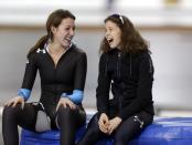 First-place finisher Maria Lamb, right, talks with second-place finisher Petra Acker, left, after competing in the women's 5,000 meters during the U.S. Olympic speedskating trials Wednesday, Jan. 1, 2014, in Kearns, Utah. (AP Photo/Rick Bowmer)