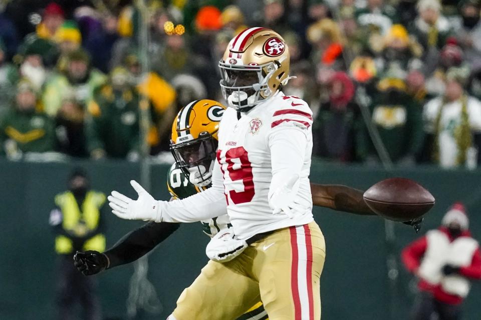 Green Bay Packers' Darnell Savage breaks up a pqass intended for San Francisco 49ers' Deebo Samuel during the first half of an NFC divisional playoff NFL football game Saturday, Jan. 22, 2022, in Green Bay, Wis. (AP Photo/Morry Gash)