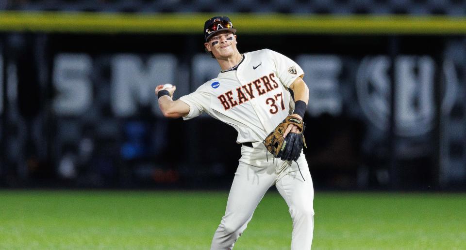 Oregon State infielder Travis Bazzana (37) throws the ball against Kentucky on June 9 in Lexington, KY.