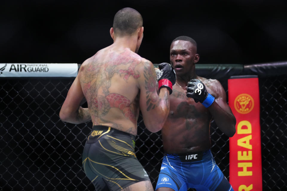 Apr 8, 2023; Miami, Florida, USA; Alex Pereira (red gloves) fights Israel Adesanya (blue gloves) during UFC 287 at Miami-Dade Arena. Mandatory Credit: Rich Storry-USA TODAY Sports