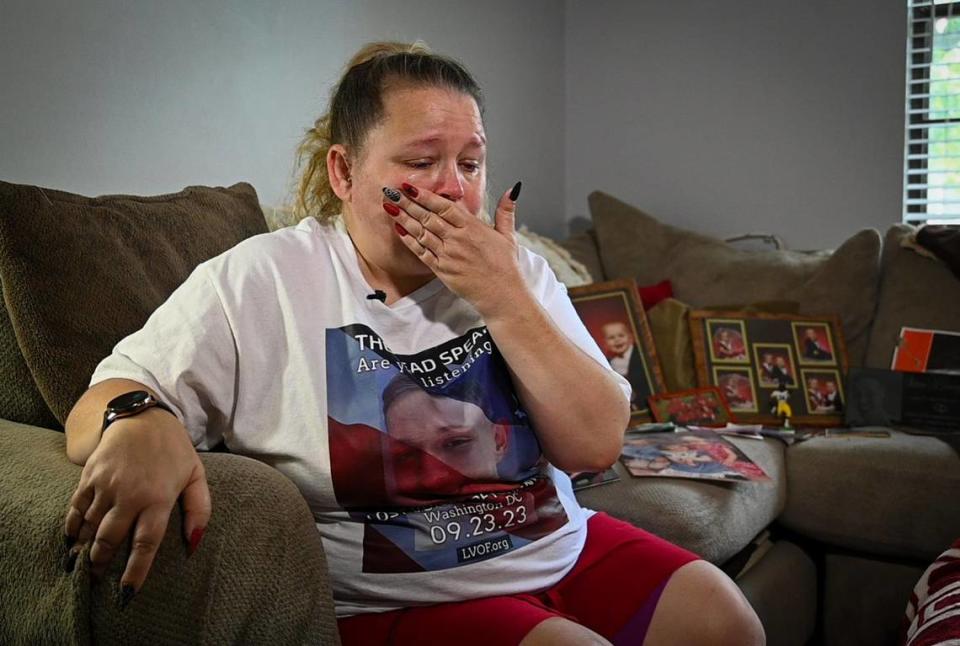 Shannon Earnshaw of Bonner Springs, Kansas, wipes tears from her face as she talks about losing her only son, Shawn Dewey II, 25. He died after taking a pill “laced with fentanyl,” Earnshaw said.