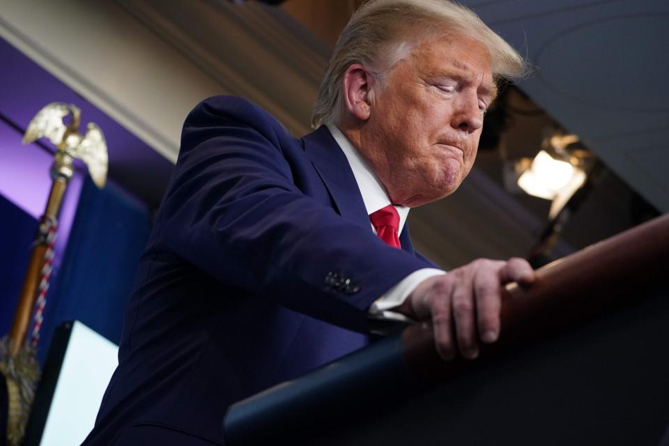 Donald Trump at a White House briefing on the coronavirus pandemic: AFP via Getty Images