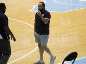 Notre Dame head coach Mike Brey looks on before an NCAA college basketball game against North Carolina in Chapel Hill, N.C., Saturday, Jan. 2, 2021. Brey said he took the notion of acceptable coaching attire to a "ridiculously new level" for the Jan. 2 game at North Carolina. He said wanted to loosen up his players, so he put on the gray shorts under his blue polo. (AP Photo/Gerry Broome)