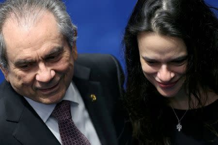 Senator Raimundo Lira (L), president of a special senate committee that will consider Rousseff's impeachment, speaks with Brazilian jurist Janaina Paschoal (R), co-author of the complaint that originated the impeachment process against Rousseff, during a final session of debate and voting on suspended Rousseff's impeachment trial in Brasilia, Brazil August 25, 2016. REUTERS/Ueslei Marcelino