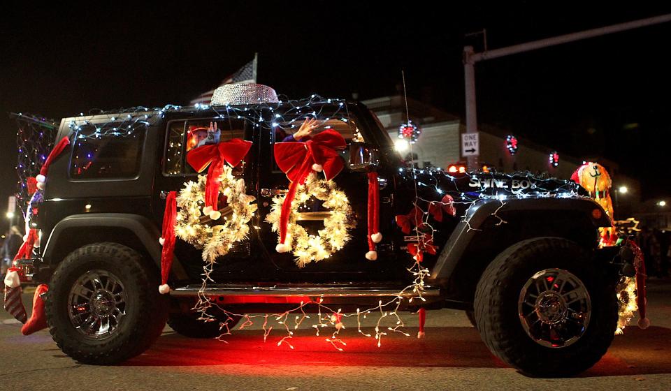 One of the Bedford Jeepers rounds the square during the Bedford Christmas parade Saturday. The Jeepers, a club formed in 2021 by Bedford Jeep enthusiasts, had about 30 vehicles as part of their entry, and the club won "Best Overall" award in the parade.