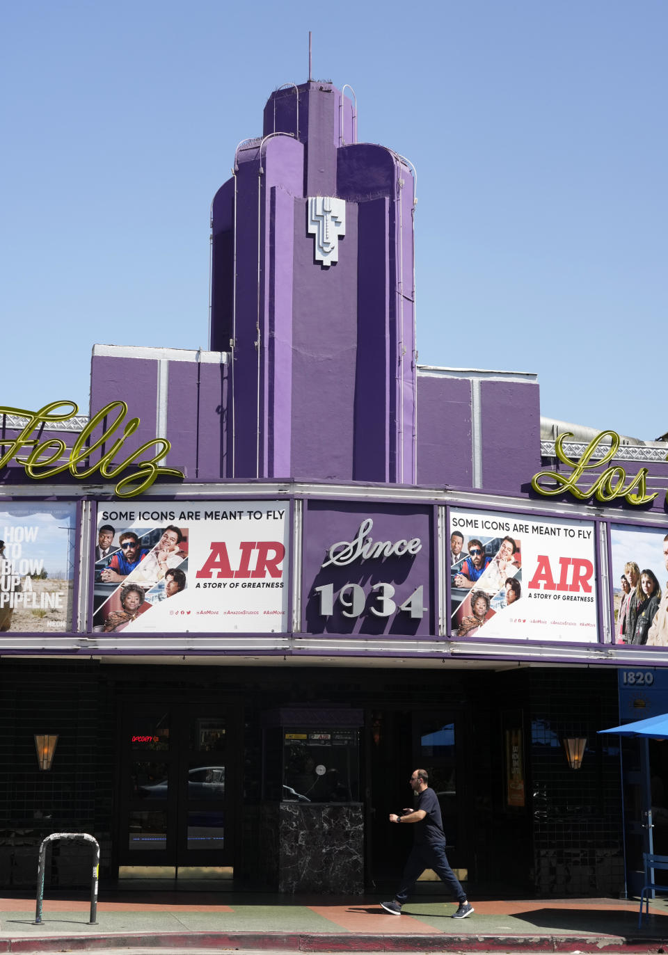 Poster art for the Amazon Studios film "Air" is displayed on the marquee of the Los Feliz Theater, Wednesday, April 19, 2023, in Los Angeles. Amazon Studios plans to release 12 to 15 movies theatrically every year, and Apple is set to spend $1 billion a year on movies that will land in cinemas before streaming. (AP Photo/Chris Pizzello)