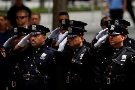 An Honor Guard of First Responders salutes during the ceremony marking the 15th anniversary of the attacks on the World Trade Center at The National September 11 Memorial and Museum in Lower Manhattan in New York City, U.S. September 11, 2016. REUTERS/Brendan McDermid