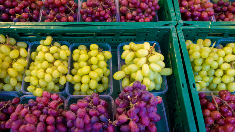 baskets of grapes in supermarket
