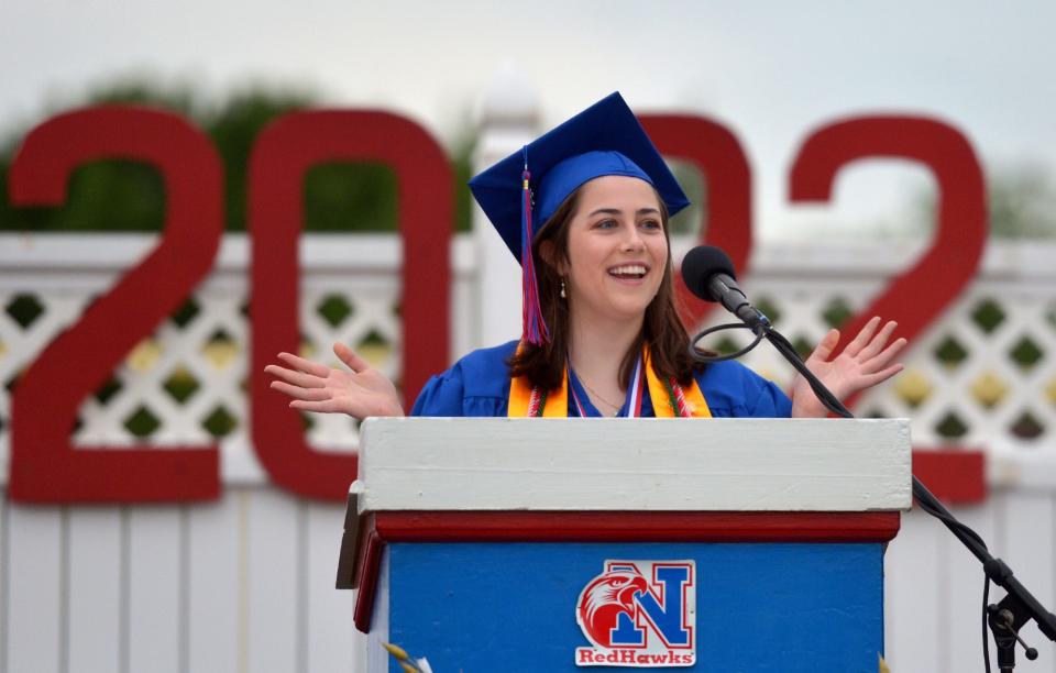 Natick High School graduate Lianna Paglia speaks at graduation ceremonies at Memorial Field, June 3, 2022.