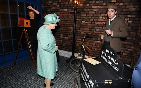 The Queen sees inside a replica of one of the original Sainsbury's stores in Covent Garden - Credit: Reuters