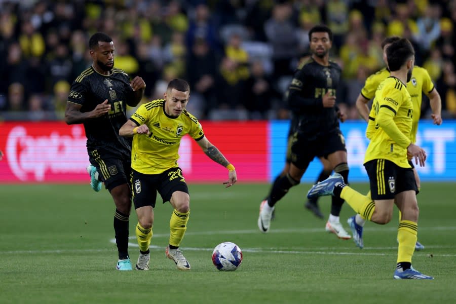 COLUMBUS, OHIO – DECEMBER 09: Alexandru Măţan #20 of Columbus Crew controls the ball while defended by Kellyn Acosta #23 of Los Angeles FC during the first half during the 2023 MLS Cup at Lower.com Field on December 09, 2023 in Columbus, Ohio. (Photo by Patrick Smith/Getty Images)