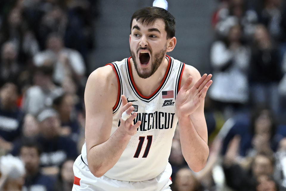 UConn forward Alex Karaban reacts in the second half of an NCAA college basketball game against Georgetown, Sunday, Jan. 14, 2024, in Hartford, Conn. (AP Photo/Jessica Hill)