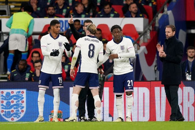 Kobbie Mainoo, right, replaces Conor Gallagher as Marcus Rashford, left, also comes on