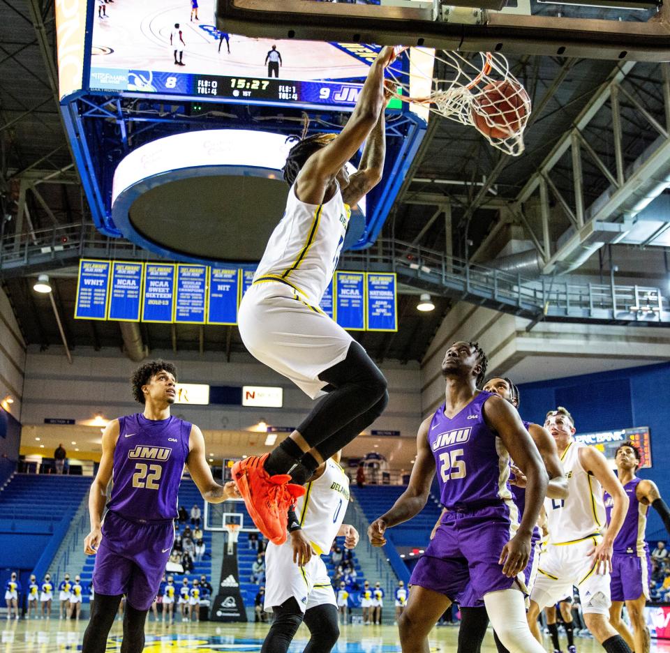 Jyare Davis dunks for two of his 14 points in Delaware's win over James Madison Monday night at the Carpenter Center.