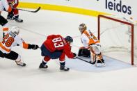 Apr 22, 2016; Washington, DC, USA; Philadelphia Flyers goalie Michal Neuvirth (30) makes a save on Washington Capitals center Jay Beagle (83) in the third period in game five of the first round of the 2016 Stanley Cup Playoffs at Verizon Center. Mandatory Credit: Geoff Burke-USA TODAY Sports