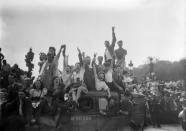 Crowds celebrate after French and Allied soldiers enter Paris in August 1944, confirming its liberation from the Nazis