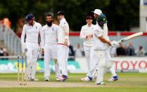 Britain Cricket - England v Pakistan - Second Test - Emirates Old Trafford - 25/7/16 England's Moeen Ali celebrates taking the wicket of Pakistan's Yasir Shah Action Images via Reuters / Jason Cairnduff Livepic