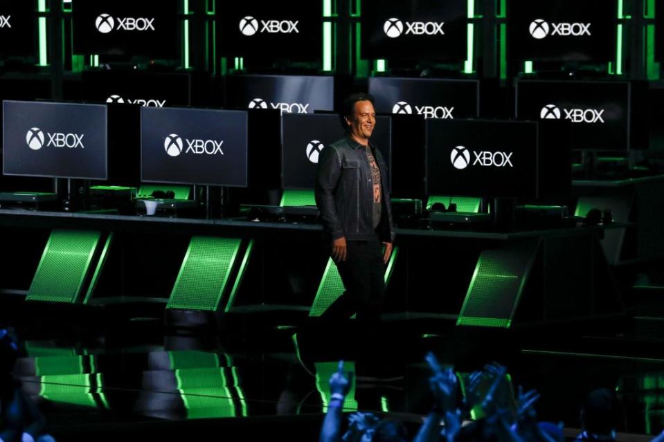 Phil Spencer, executive vice president of Gaming for Microsoft Corp., speaks during the company's Xbox event ahead of the E3 Electronic Entertainment Expo in Los Angeles, California, U.S., in Los Angeles, California, U.S., on Sunday, June 10, 2018. Xbox previewed a flurry of new titles and deals with studios as the video-gaming division of Microsoft looks to compete more intensely with Sony Corp.'s PlayStation and a resurgent Nintendo Co. Photographer: Patrick T. Fallon/Bloomberg via Getty Images