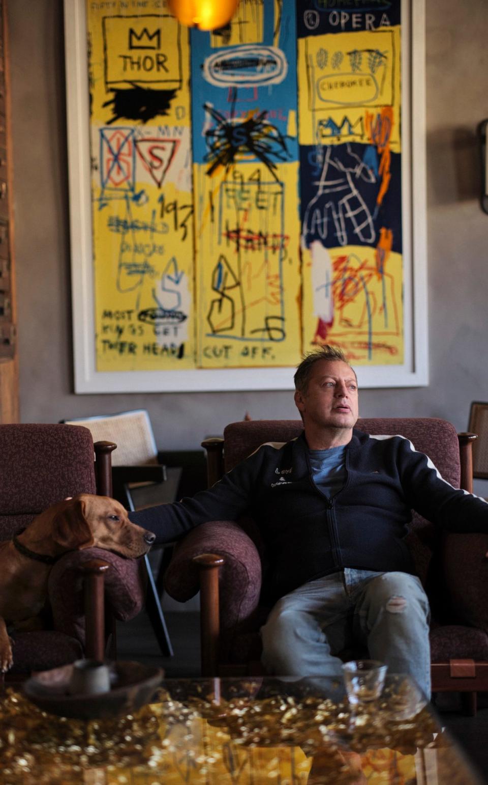 Matthew Freud with Oscar in front of Charles the First by Jean-Michel Basquiat, from Bull's art collection