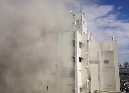 Smoke is seen coming out of a Mahanagar Telephone Nigam Limited building after a fire broke out, in Mumbai