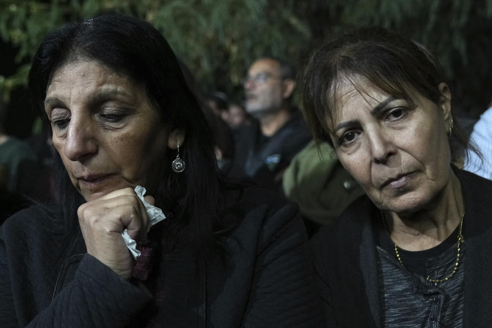 Mourners attend the funeral for Tamir Avihai, 50, in the West Bank Israeli settlement of Barkan, Tuesday, Nov. 15, 2022. A Palestinian killed three Israelis, including Avihai and wounded three others in an attack in a settlement in the occupied West Bank on Tuesday before he was shot and killed by Israeli security personnel, Israeli paramedics and Palestinian officials said. (AP Photo/ Tsafrir Abayov)