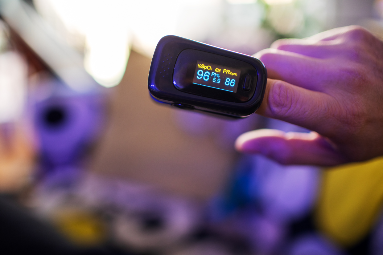 Pulse Oximeter for checking oxygen saturation in blood on male hand