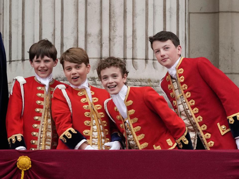 Page of Honour Lord Oliver Cholmondeley, Prince George of Wales, Page of Honour Nicholas Barclay, and Page of Honour Ralph Tollemache seen on the Buckingham Palace balcony.
