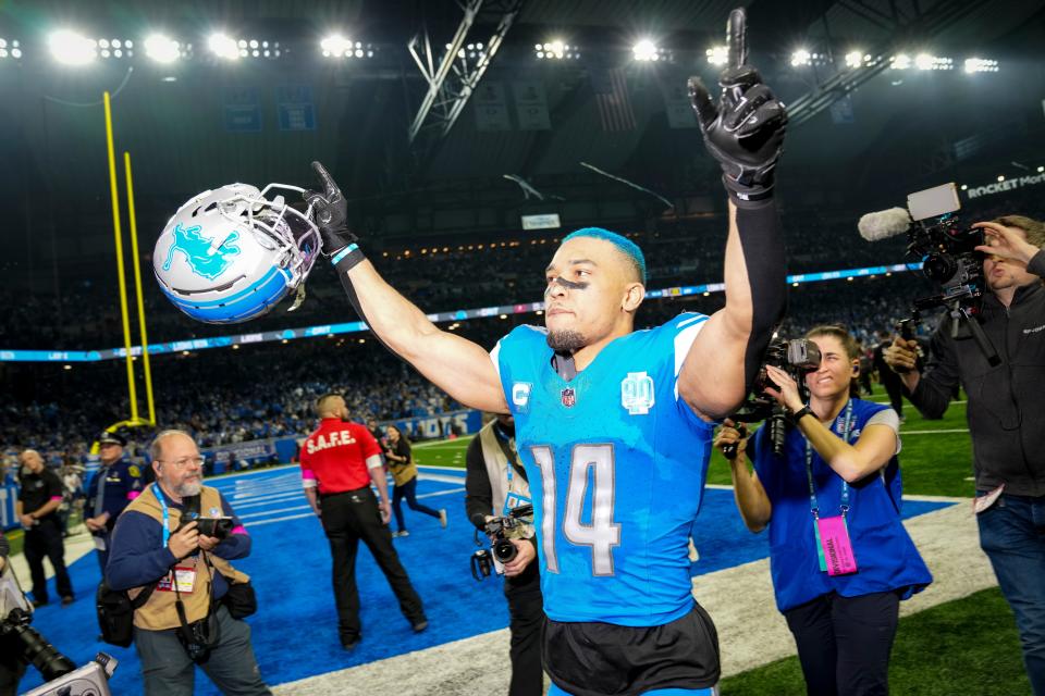 St. Brown shows off his Honolulu blue hairdo after beating the Buccaneers in the Divisional Round