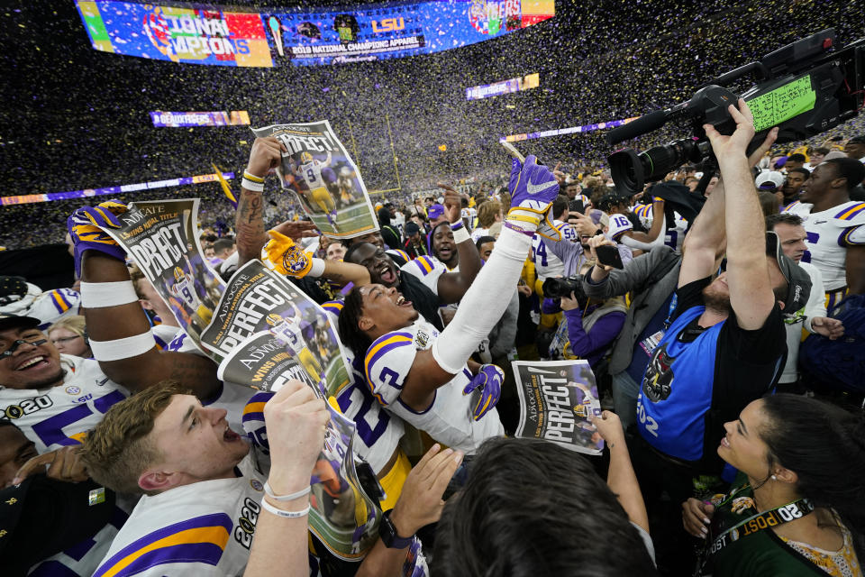 FILE - In this Jan. 13, 2020, file photo, LSU celebrates after their win against Clemson in a NCAA College Football Playoff national championship game in New Orleans. The photo was part of a series of images by photographer David J. Phillip which won the Thomas V. diLustro best portfolio award for 2020 given out by the Associated Press Sports Editors during their annual winter meeting. (AP Photo/David J. Phillip, File)
