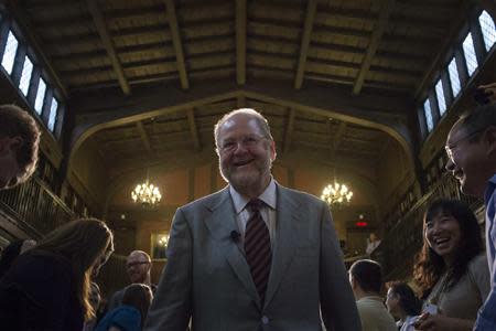 Yale University Professor James Rothman, 62, the co-awardee of the 2013 Nobel Prize for Medicine, arrives to a standing ovation before attending a press conference at Yale University in New Haven, Connecticut, October 7, 2013. REUTERS/Adrees Latif